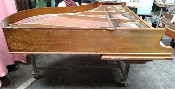 grand piano before black french polish restoration